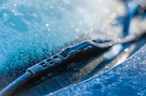 Frosted car window needing antifreeze