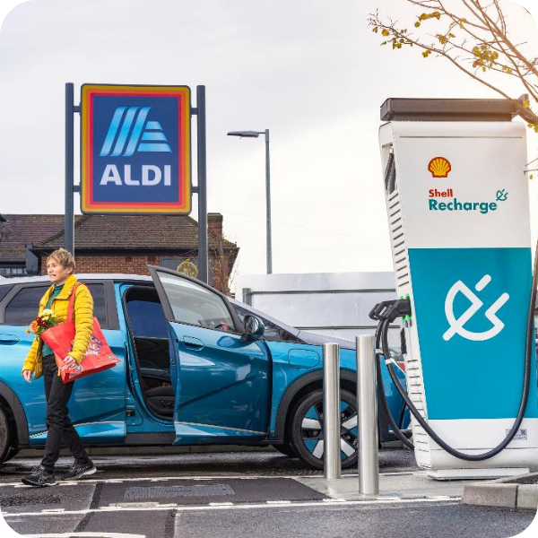 Electric vehicle charging at a Shell Recharge charger outside Aldi with access to Shell Recharge roaming partners.