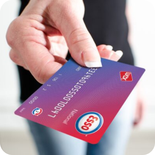 Driver holding an Esso FORS fuel card highlighting fuel cost savings, fuel management and FORS compliance support for fleet operators.