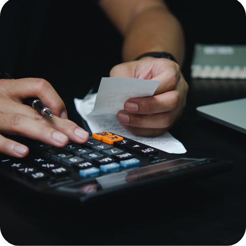 Fuel Card VAT Reclaim: Business owner calculating fuel expenses and reviewing receipts, highlighting fuel card VAT reclaim and simplified fuel administration.