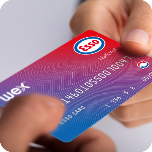 Fuel Card Vs Company Credit Card: Business driver holding an Esso fuel card, highlighting the differences between a fuel card and a company credit card for managing fleet fuel expenses.