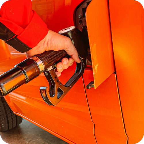Fuel Card Vs Credit Card: Driver refuelling a commercial vehicle with diesel, highlighting business fuel purchases and fleet fuel cost management.