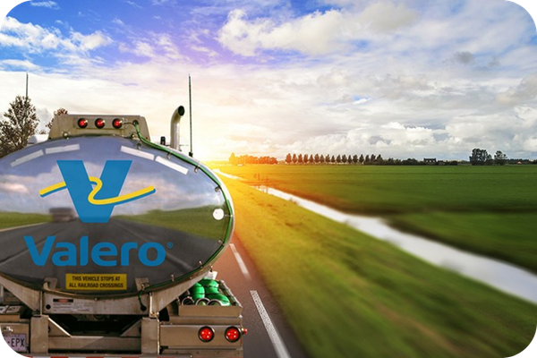 Valero fuel tanker travelling through the countryside, representing the growth of the Valero fuel station network and nationwide fuel card coverage for UK fleets.