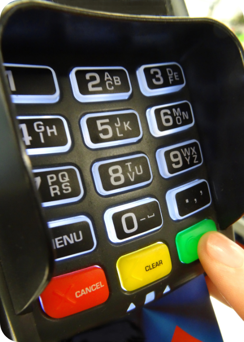 Fuel Card Security Tips: Driver entering a secure PIN on a fuel card payment terminal at a fuel station to authorise a fuel purchase.