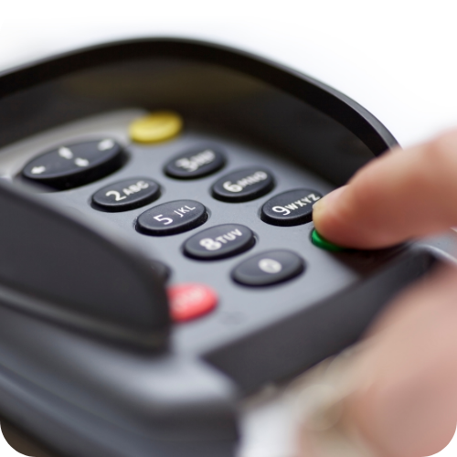 Fuel Card Security: Driver entering a secure PIN on a fuel card payment terminal, demonstrating fuel card security, transaction protection, and fraud prevention for business fleets.