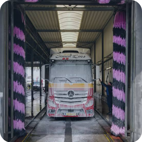 HGV receiving a professional truck wash using the Shell Card TRAVIS truck wash network.
