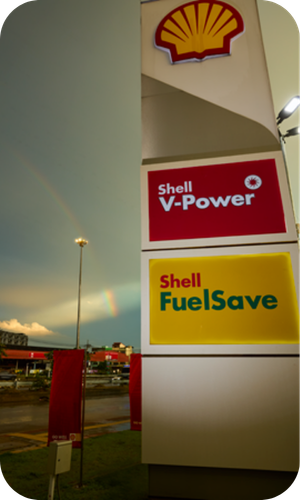 Shell forecourt sign promoting Shell FuelSave Petrol and Shell V-Power performance fuel